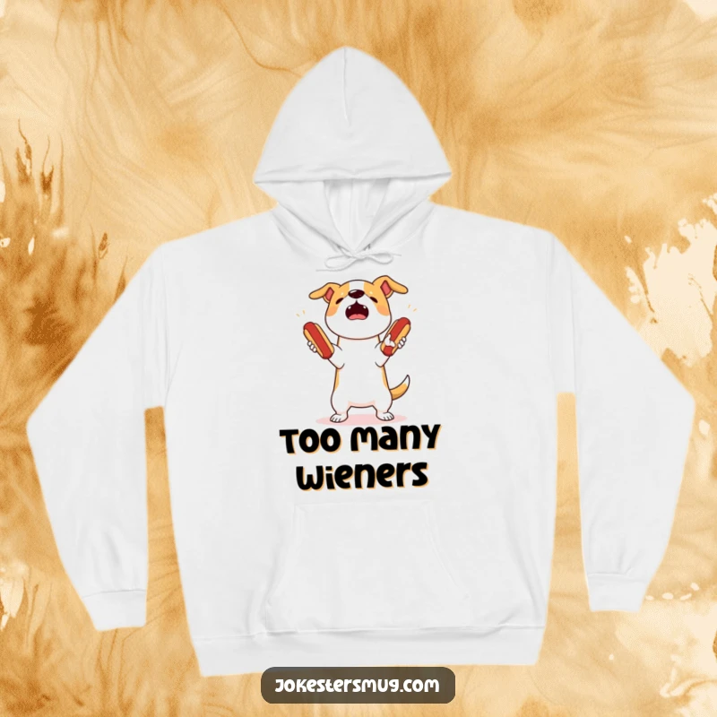 Funny dog juggling hoodie showing a startled dog attempting to juggle three bouncing hot dogs, dropping them all in a comical mess.