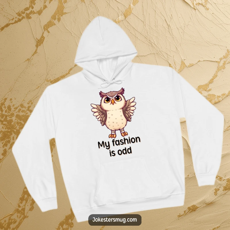 Funny owl struggling to wear socks on its wings, featured on a warm hoodie for humorous and cozy wear.