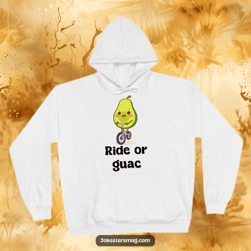 Funny hoodie with a smiling avocado precariously balancing on a tiny unicycle, conveying a sense of playful achievement.