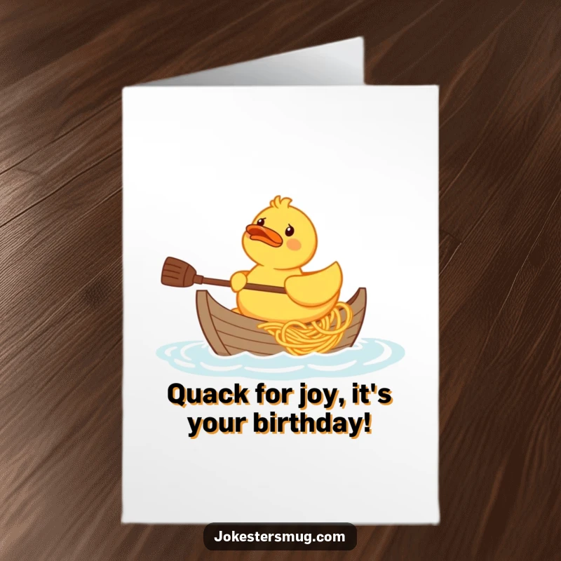 Funny Free Printable Birthday Card: A confused rubber duck struggles to paddle a boat made entirely of spaghetti.