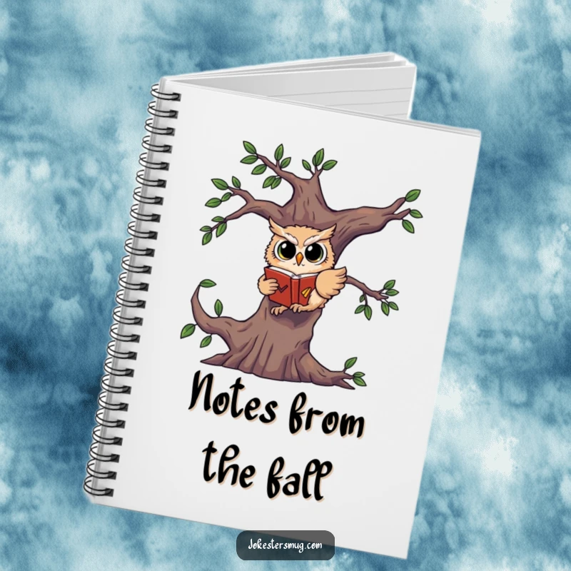 Funny notebook cover with a startled owl falling from a tree, clutching a book, ready for notes.