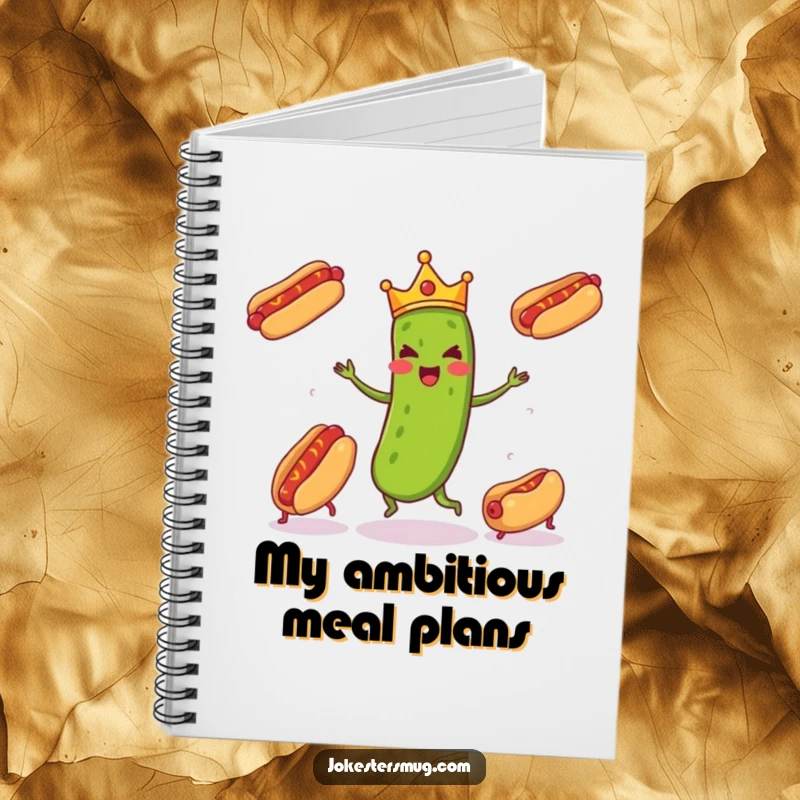 Funny pickle wearing a tiny crown enthusiastically juggling three runaway hot dogs, inspiring notes and doodles in this funny notebook.