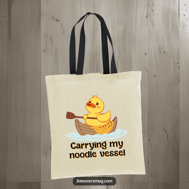Funny confused rubber duck character trying to paddle a boat made of spaghetti, printed on a durable tote bag.