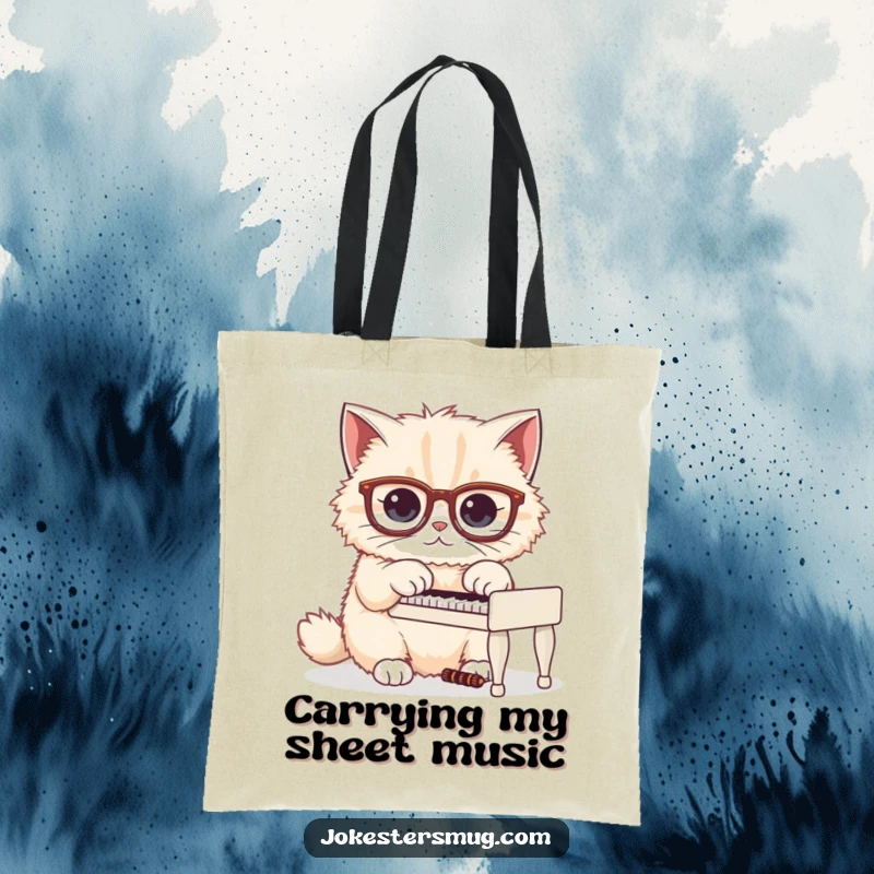 Funny tote bag featuring a fluffy cat sporting oversized glasses, humorously trying to play a miniature piano.
